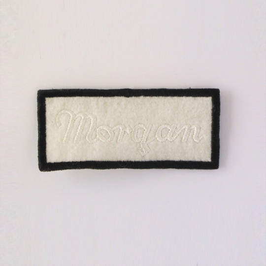 Embroidered Morgan script badge (white on white)