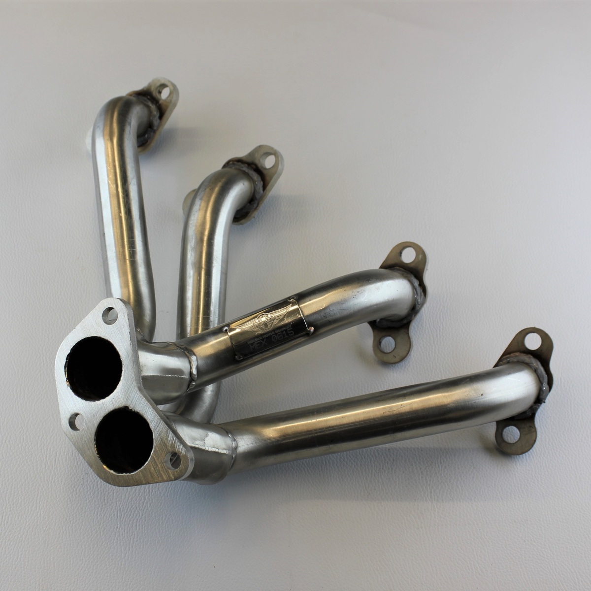 Manifold left hand +8 5 speed to 1987