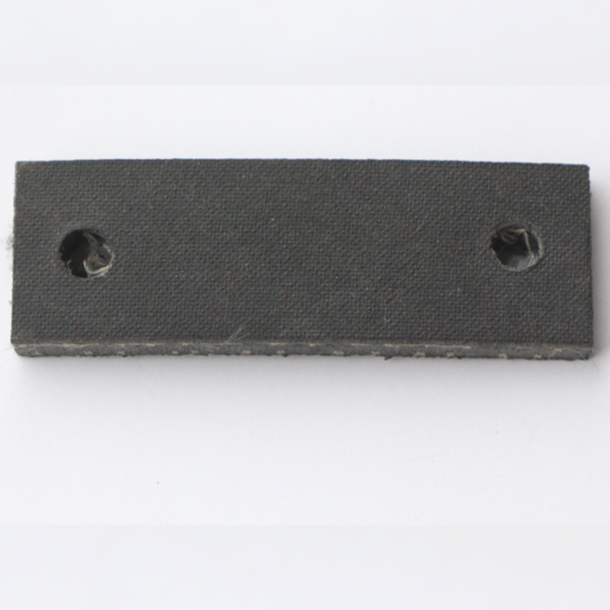 Rubber strap for handbrake cable - holds it to rear axle