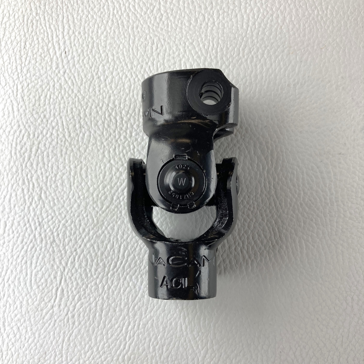 Universal joint between steering rack & lower steering shaft