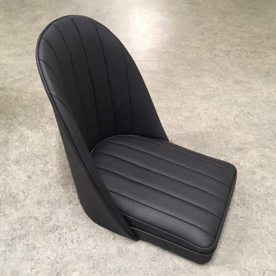 Bucket seat in black leather with wooden floor (straight sides, so not...